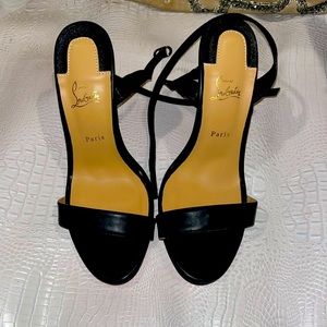 Louboutin heels with wrap ankle. Only worn once.